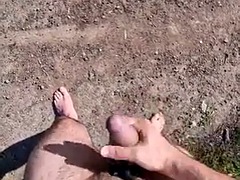Cumming completely naked in an open parking lot