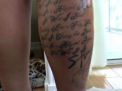 Tattooed dominatrix fingers her sub slave