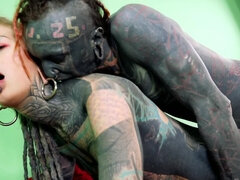 Totally tattooed freak with long dreadlocks fucks his girlfriend