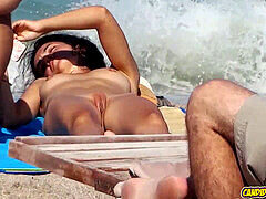 Hidden camera spies on amateur milfs at nude beach by the seaside