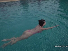 Beautiful asian girl in the pool