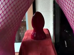 Sissy squirts piss through her cock cage while stretching her anal pussy with big toys