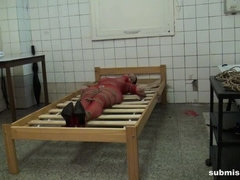 Cindy in the butchery bound to the bed