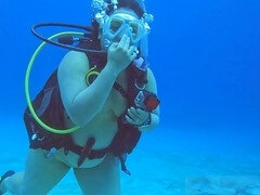 Naked duo has some fun scuba diving together