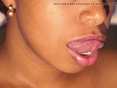 Sexy lips ebony play with her red lipstick close up