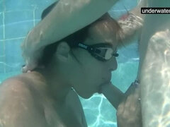Submerged underwater with a dick inside her