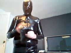 layers of masks, catsuit and wanking hands-free almaost