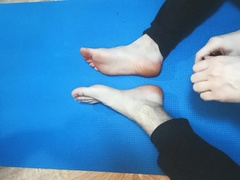 The dude gropes his soles with lubricant