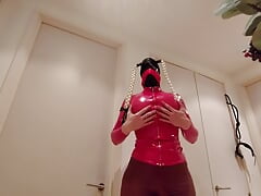 Busty sissy bimbo in red latex dancing