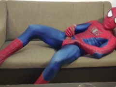 Horny Spiderman jerks off and cums massive load