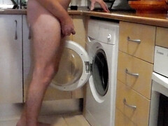 John is peeing all into the washing machine