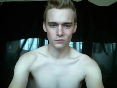 Stunning lad in blue wanking his big dick on cam before spunking