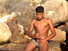 Tunisian twunk strokes his yam-sized Arab dick near the beach