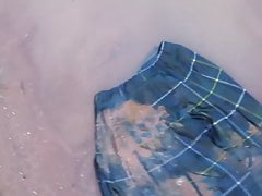 green tartan 2 skirt in mud puddle