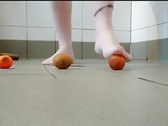 Footplay in pantyhose with fruit