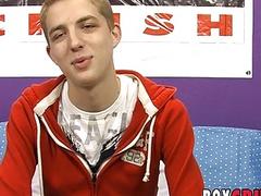 Smiling young homo jerks off and shoots his load out