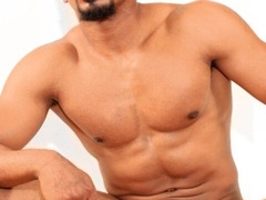 Muscular black dude with a goatee jacking his BBC