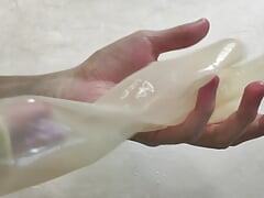 Transparent fetish gloves trying on