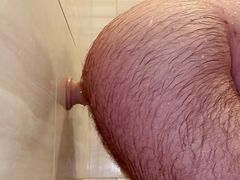 Anal Steve getting clean and down and dirty at the same time in the shower fucking a dildo making him moan and groan