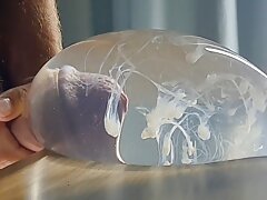 Slim guy TimonRDD cums hard in a water-filled condom