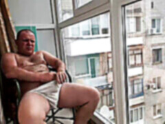 flashing off by the window smoking