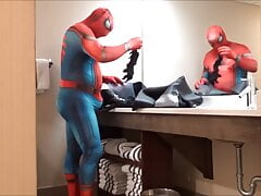 Spiderman changes into wetsuit and wank