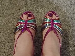 Closeup of male painted toes in rainbow heels