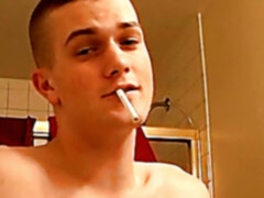 Gay jock smoking with a passion while stroking his dick