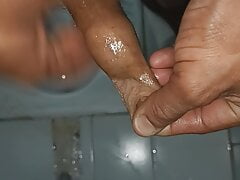 Indian middle age man massage his pennis with oil and gel