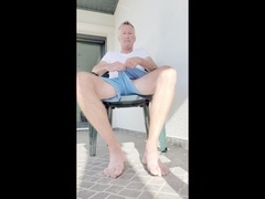 Naughty outdoor stroking and cum explosion in the courtyard.
