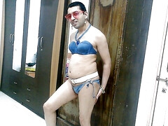 Hot sissy crossdresser femboy Sweet Lollipop in a denim bikini with accessories.