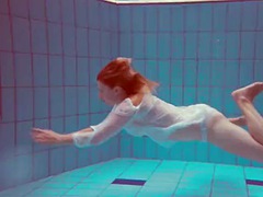 Hot babe Melisa Darkova is dressed underwater