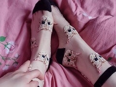 Stepsister teases in cute patterned nylon socks in point of view and gets them licked