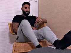 Handsome bearded man Rikk York shows off his delicious feet solo