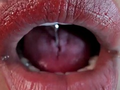 Tongue pierced ebony fetish tease spit close up