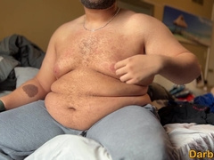 Humungous guy showcasing off his ample abdomen and dude mounds to you
