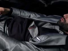 Huge, hairy hunk in a suit pleasures his cock and body