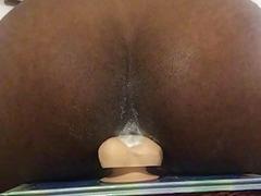 Black fucker's anus eats up an entire dildo