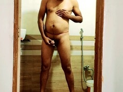 Mature man enjoys solo shower session while pleasing himself