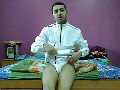 Hot and sexy boy in white jacket and thong getting naked.