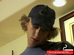 Blonde twink Casey Wood jerks off his dong while smoking