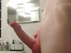 Redhead masturbates big cock mobile phone cam