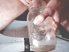 Twink pisses in jar on webcam