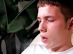 Twink strips himself naked and jerks off solo while smoking