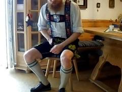 Kinky bastard pulls his dick out of lederhosen for masturbation