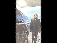 Gassing up in mini-dress