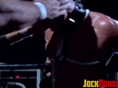 Tattooed wrestler tied up and dominated by his opponent