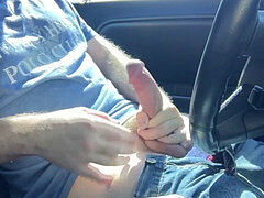 Muscular jock strokes his thick meat in public car park