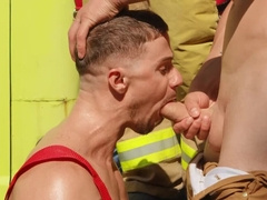 Hunks are having a threesome next to the big vehicle