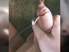 Amateurboy whips cock with electric cord